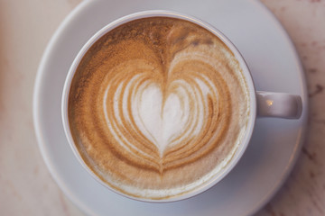 A cup of cappuccino. Macro.Shallow DOF. Toning vintage
