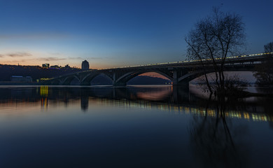 Fototapeta na wymiar Bridge Metro in Kyiv at the sunset