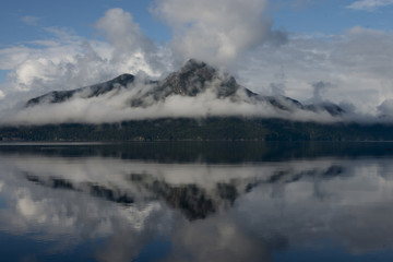 Fototapeta na wymiar Reflection of mountain in water, Furry Creek, British Columbia, Canada