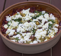 Served with tomato sauce and feta cheese