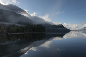 Fototapeta na wymiar Reflection of trees in water, Furry Creek, British Columbia, Canada
