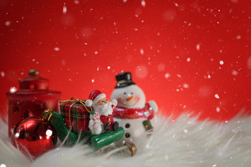 Christmas holiday background with Santa and decorations. Christmas landscape with gifts and snow. Merry christmas and happy new year greeting card with copy space.