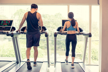 Fototapeta premium Portrait of People exercise at gym, People holding dumbbell for exercise at gym. Vintage Tone.