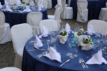 elegant table set with white chiars