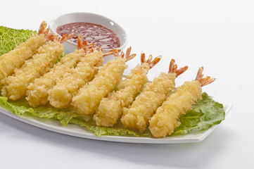 Tempura Jumbo Shrimps with salad and salsa dip on white plate and white background