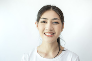 Portrait of Attractive Asian Woman smiling on white background.