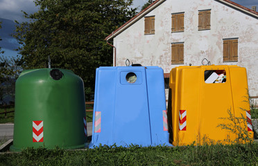 three large waste bin collectors