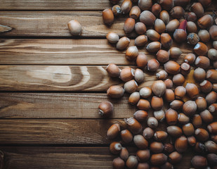 Nuts on a wooden background. Useful autumn food.
