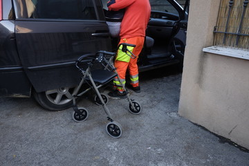 healthcare worker helps disabled wheelchair 