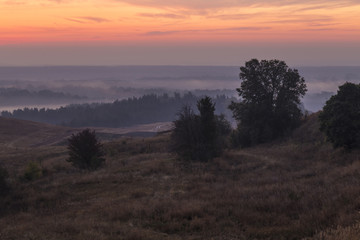 Fototapeta na wymiar Misty dawn over the hills