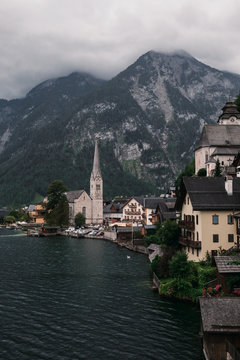 Scenic view of famous Hallstatt lakeside town reflecting in Hallstattersee lake in the Austrian Alps, Austria