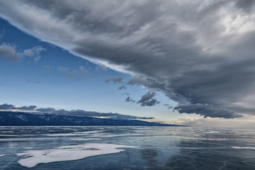 big cloud over the ice of lake Baikal