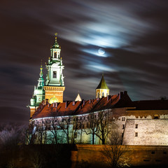Full moon over Wawel Castle in the night in Krakow, Poland