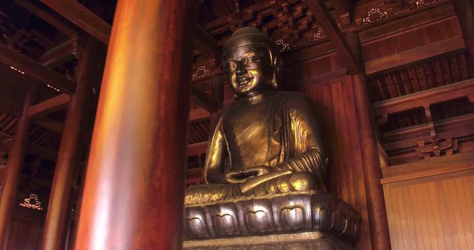 SHANGHAI, CHINA – JUNE 2016 : Video shot of golden Buddha statue in Jade Buddha temple