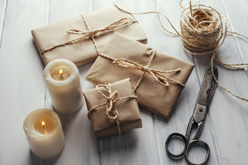 Packs wrapped in kraft paper and candles.