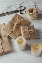 Packs wrapped in kraft paper and candles.