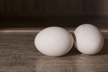 chicken eggs closeup on wooden table