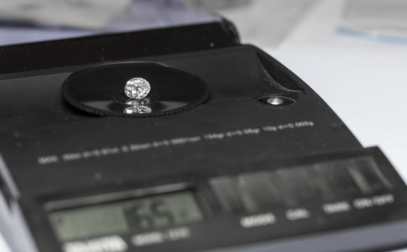 Diamond on the jewelry scales