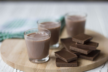 chocolate and chocolate pieces on a wooden Board on the table
