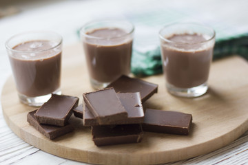 chocolate and chocolate pieces on a wooden Board on the table