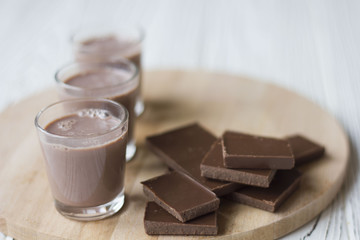 chocolate and chocolate pieces on a wooden Board on the table