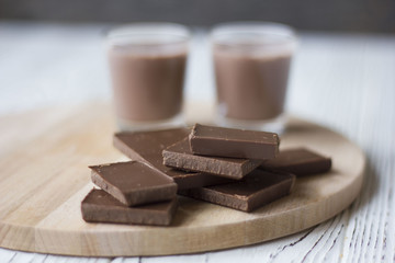 chocolate and chocolate pieces on a wooden Board on the table