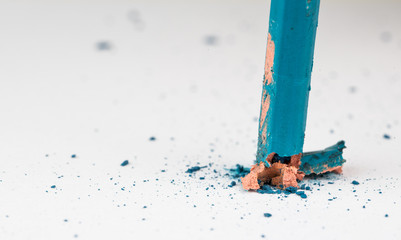 Broken blue pencil