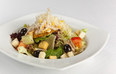 Chicken salad with tomatoes,olives,cheese and bread croutons