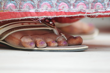 special rings and jewelry on fingers of the leg of a woman from india