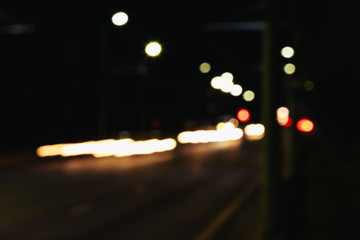 Blurred Christmas lights on a black background, bokeh. Light bokeh abstract. The concept of the new year 2018, holidays, vacation.