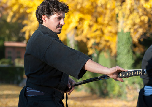 Iaido athlete draws his sword katana