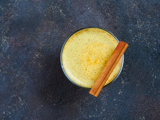 golden turmeric latte and ingredients, copy space