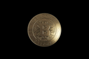 Gold coin Bitcoin on a black background. The concept of crypto currency. blockchain technology.