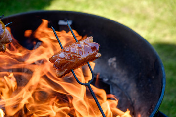 Preparing sausages on camp fire
