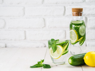 Fototapeta na wymiar infused detox water with cucumber, lemon and mint
