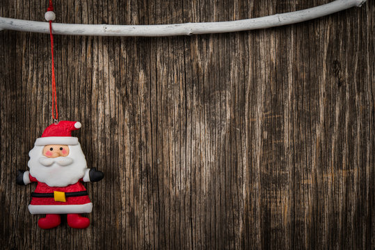 Santa decoration over rustic wooden background