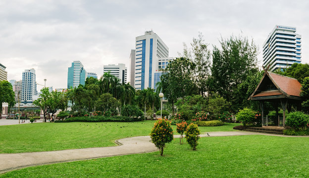 Panorama view of Bangkok skyline from Lumphini Park, Thailand. Lumphini Park is a popular place for walks and sport activities in the heart of Bangkok