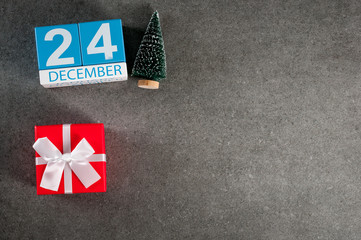 Eve. December 24th. Image 24 day of december month, calendar with x-mas gift and christmas tree. New year background with empty space for text, mockup