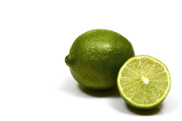Studio shot image of juicy organic ripe limes isolated on a white background  