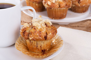 Fototapeta na wymiar Golden Brown Muffin and Cup of Coffee