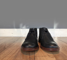 Mens black boots on floor