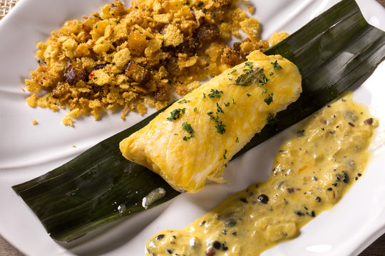 Fried fish with farofa and passion fruit sauce - Traditional amazonian dish - Filhote caboclo