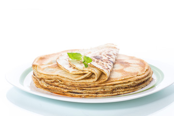 thin delicious pancakes in a plate