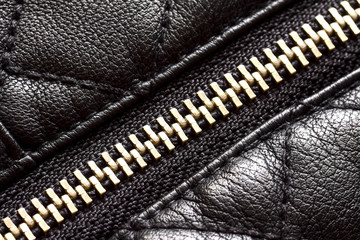 Close up of a zip on synthetic leather material 