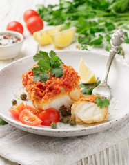 White fish (cod, Pollock, nototenia, hake), braised with onions, carrots and tomatoes. Vegetable marinade. Delicious hot or cold snacks for foodies. Selective focus