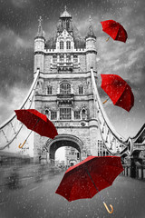 Fototapety  Tower Bridge on River Thames with flying umbrellas. London, England. Black and white concept graphic with red element.