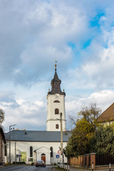 Fototapeta na wymiar View of the reformed church against the blue sky in Nagykallo, Hungary
