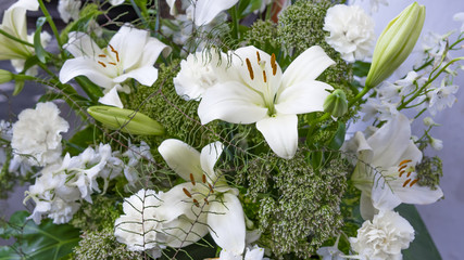 Gorgeous bouquet of white lilies and carnations flowers.