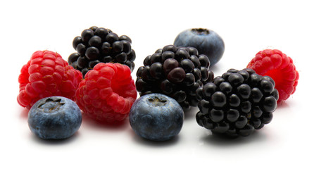Berries isolated on white background blackberry blueberry and raspberry mix.