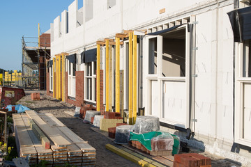 Building family houses with sand-lime bricks at a construction site